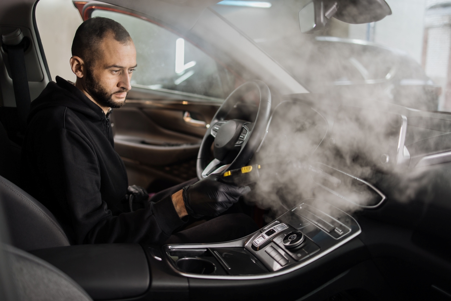 Technician repairing the cooling system of a vehicle at DriveTime Automotive in Salem, OR