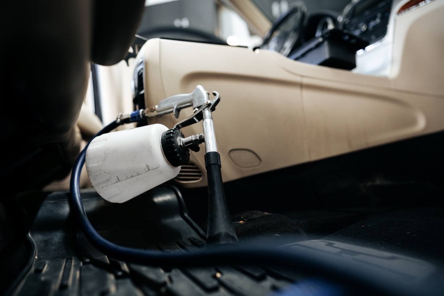 Technician repairing a car's power steering system at DriveTime Automotive in Salem, OR.