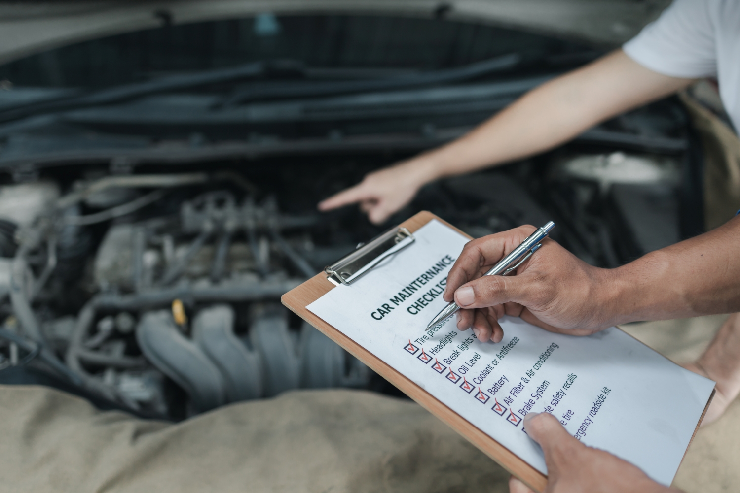 Technician performing a pre-purchase car inspection at DriveTime Automotive in Salem, OR.