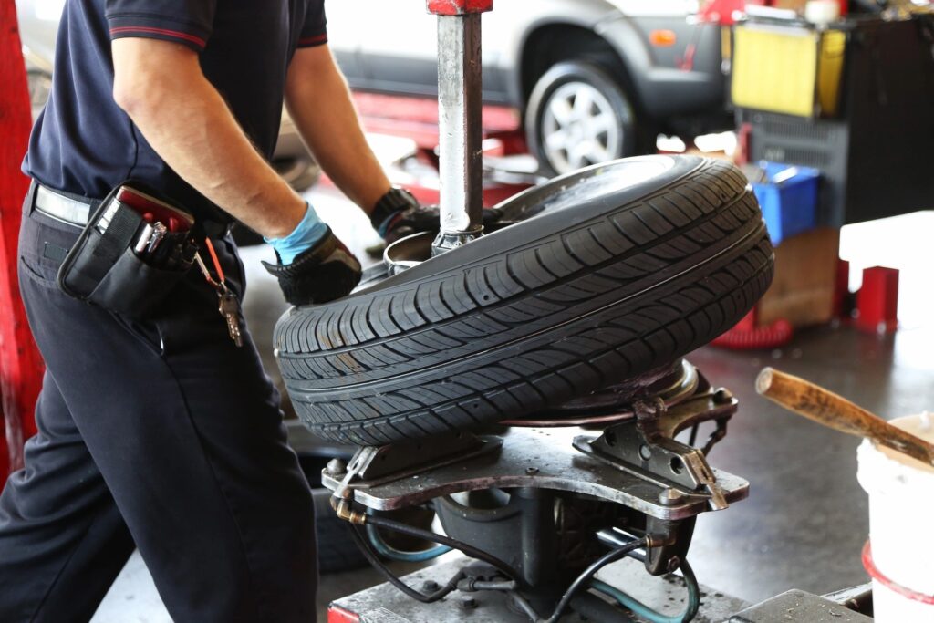 Mechanic balancing a tire.