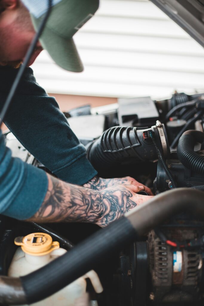 Professional auto mechanic performing a detailed repair at DriveTime Automotive in Salem, Oregon. Trusted local experts for all your auto repair needs.