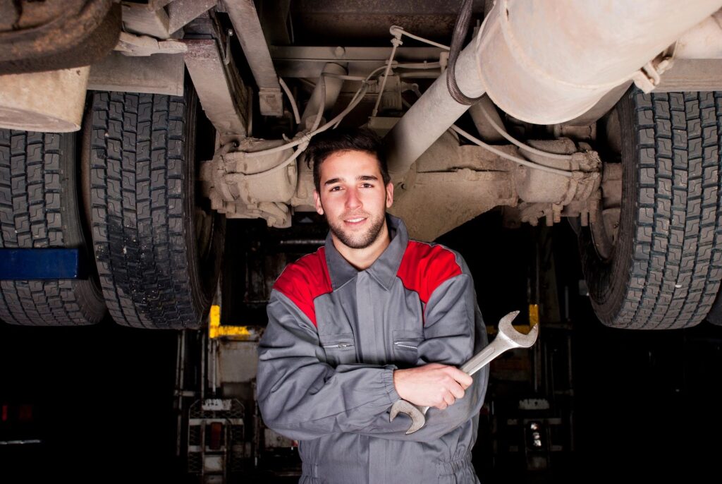 A skilled technician working on a car engine at DriveTime Automotive in Salem, Oregon.